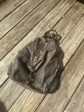 Men's Brown Leather Duffel Backpack with Studded Detail.